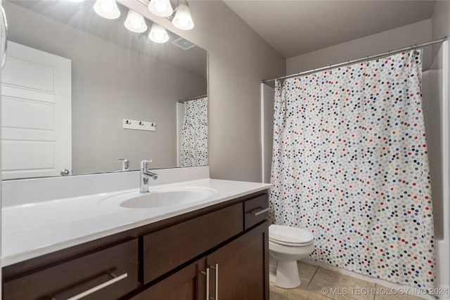 bathroom with walk in shower, tile patterned flooring, vanity, and toilet