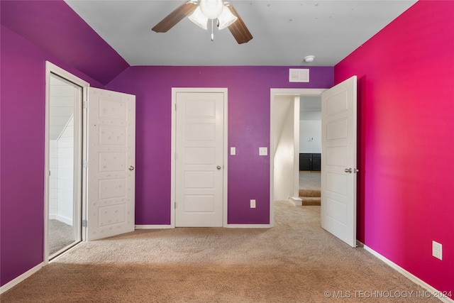 unfurnished bedroom featuring ceiling fan and light carpet