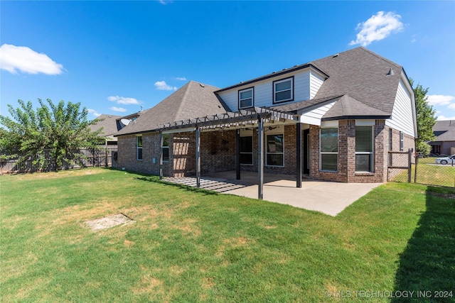 rear view of property featuring a pergola, a yard, and a patio