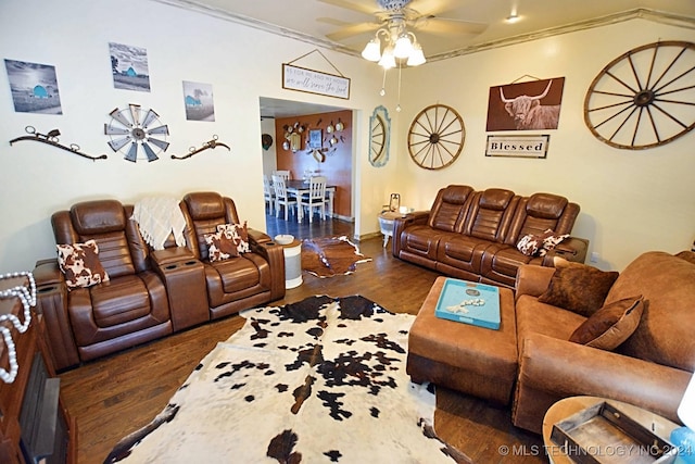 living room with ornamental molding, ceiling fan, and dark wood-type flooring