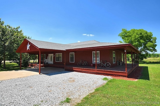 exterior space with a porch and a lawn