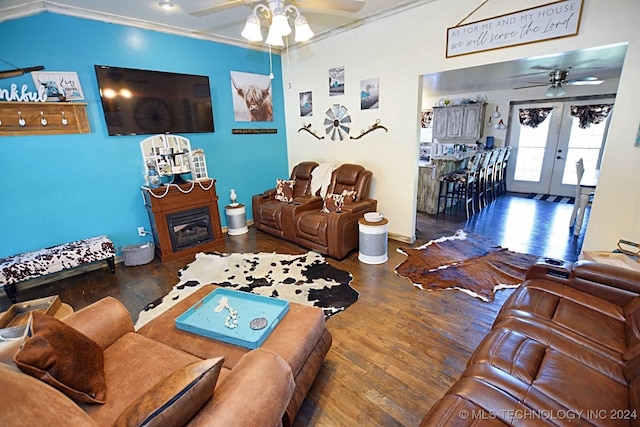 living room featuring dark hardwood / wood-style floors, ceiling fan, ornamental molding, and french doors