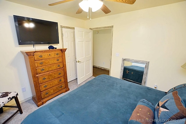 bedroom with ceiling fan and carpet floors