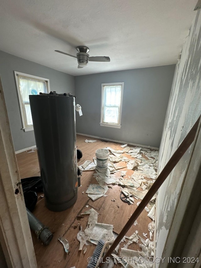 miscellaneous room featuring ceiling fan and hardwood / wood-style floors