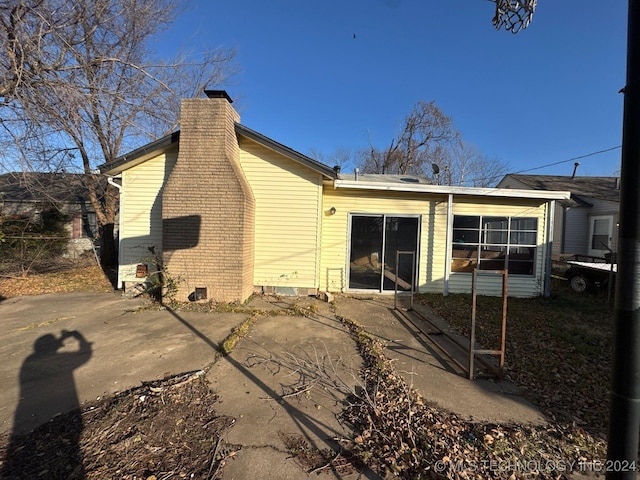 back of house with a patio