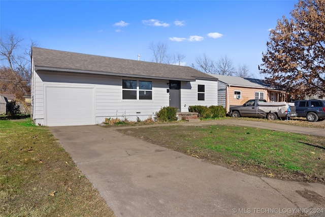 ranch-style house with a garage and a front yard