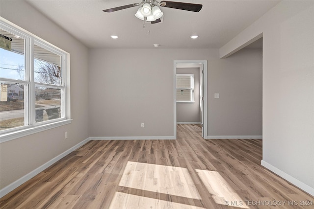 spare room featuring wood-type flooring and ceiling fan