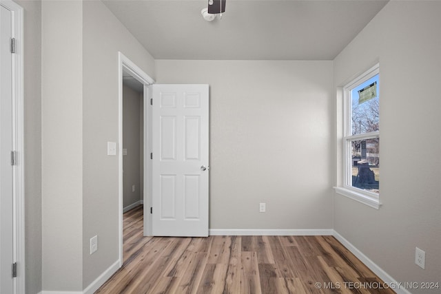 unfurnished bedroom featuring wood-type flooring