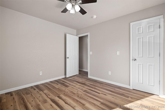 unfurnished bedroom featuring ceiling fan and wood-type flooring