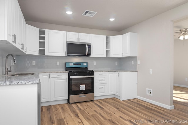 kitchen featuring white cabinetry and stainless steel appliances