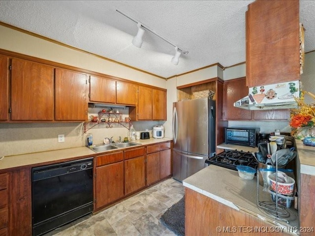 kitchen featuring sink, black dishwasher, stainless steel fridge, track lighting, and a textured ceiling