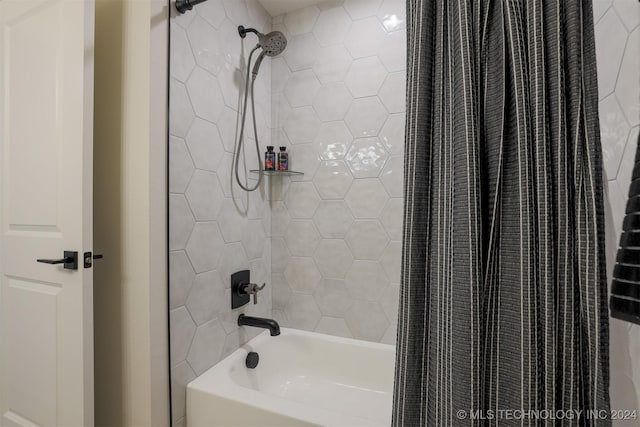 bathroom with shower / bathtub combination with curtain