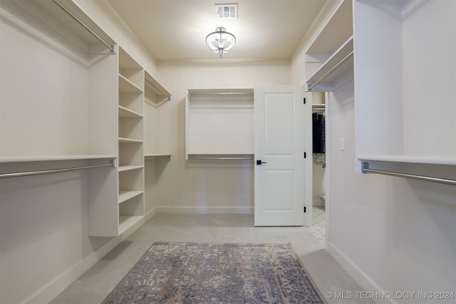 walk in closet with visible vents