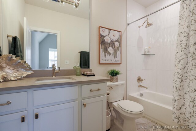 full bathroom with tile patterned floors, vanity, toilet, and shower / bath combo with shower curtain