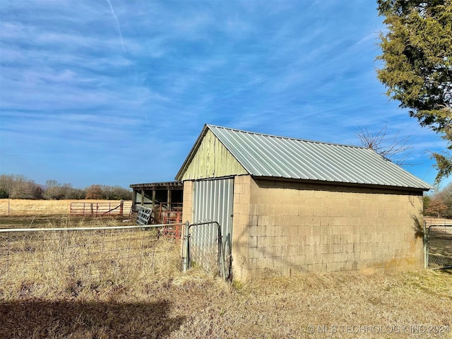 view of outbuilding with a rural view