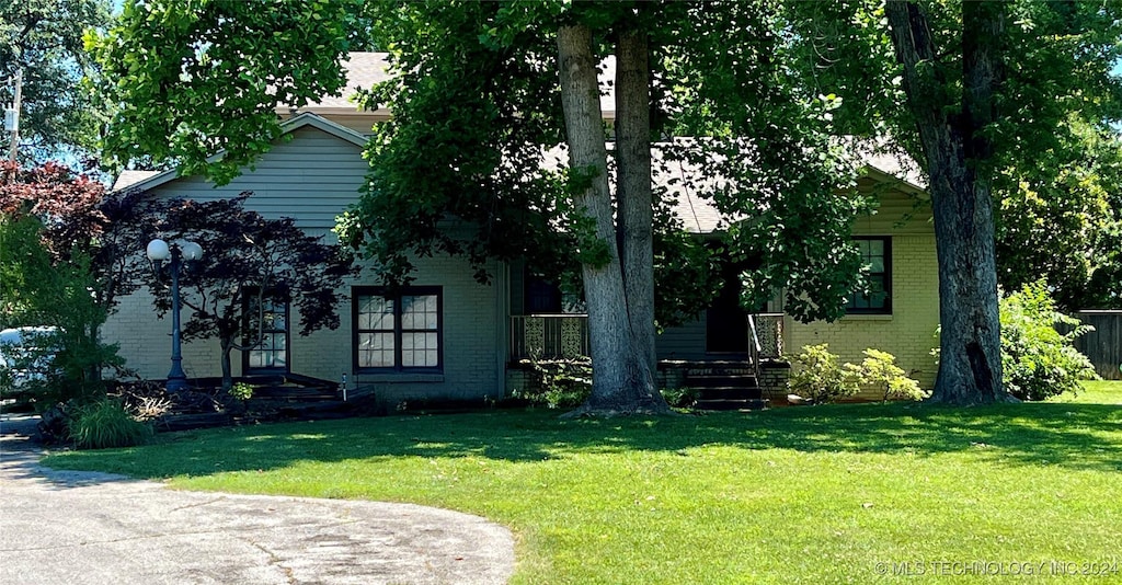 exterior space with a lawn