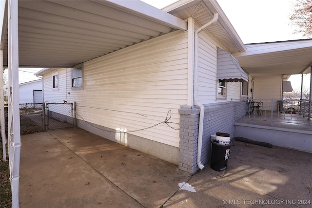 view of home's exterior featuring a carport