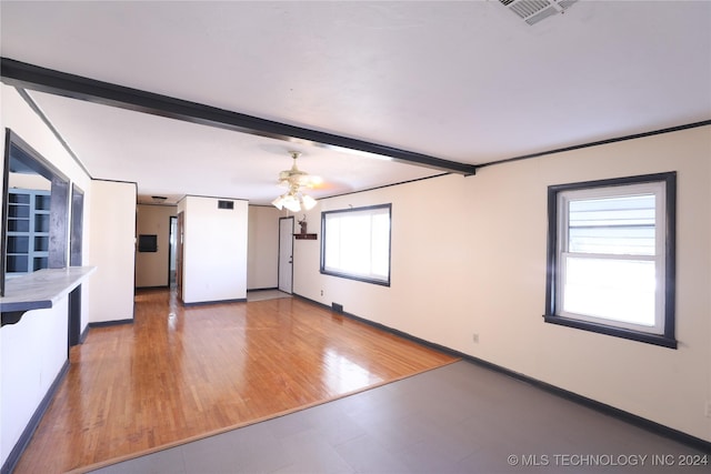 unfurnished living room with hardwood / wood-style flooring, a wealth of natural light, and ceiling fan