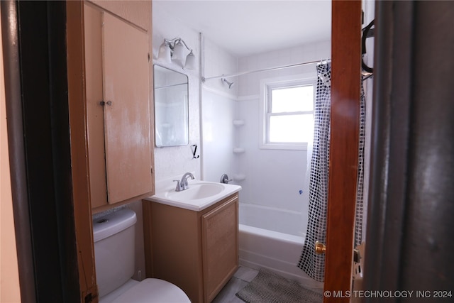 full bathroom with tile patterned flooring, vanity, shower / tub combo, and toilet