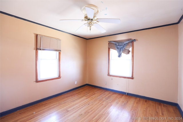 unfurnished room featuring light hardwood / wood-style floors, plenty of natural light, crown molding, and ceiling fan