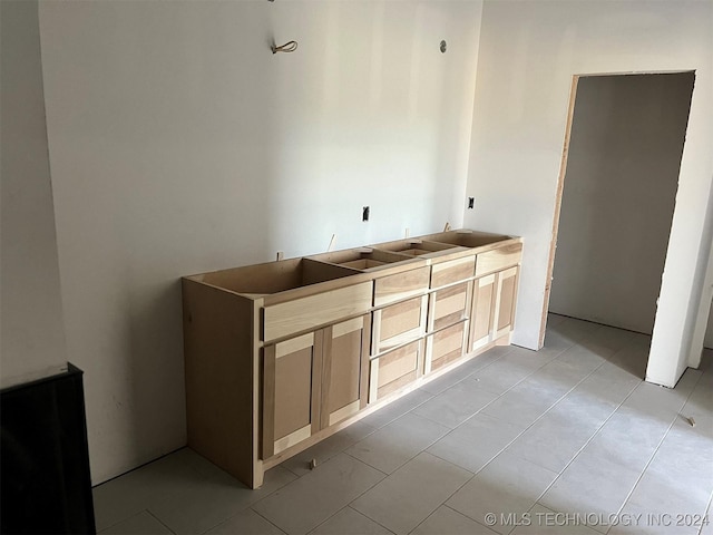 bathroom featuring tile patterned flooring