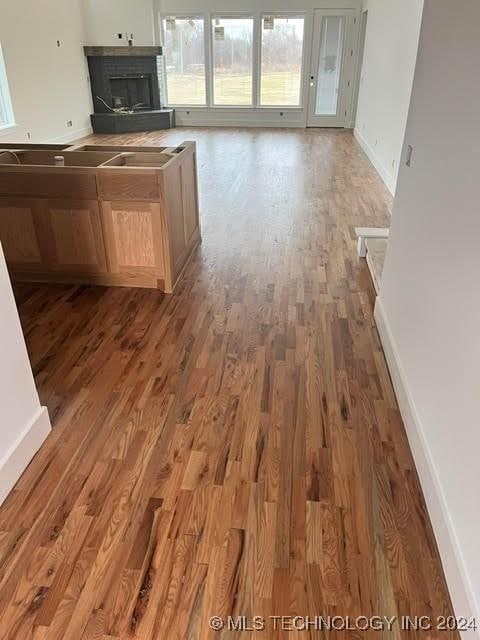 kitchen featuring hardwood / wood-style floors and light brown cabinets