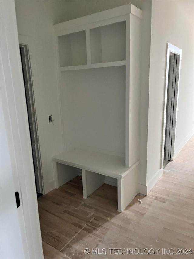 mudroom featuring light hardwood / wood-style floors and built in features