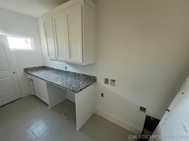 laundry area with hookup for a washing machine and cabinets