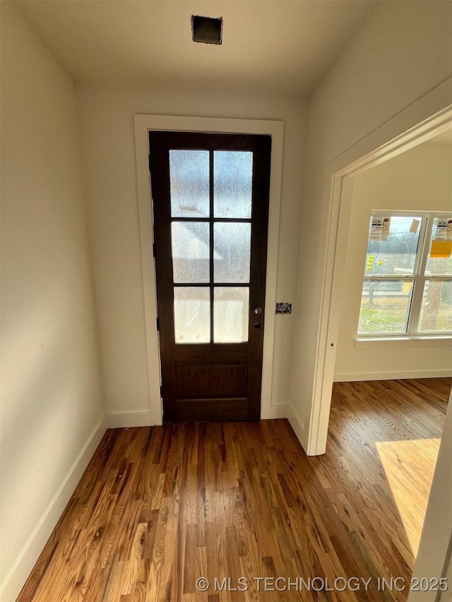 doorway featuring hardwood / wood-style floors