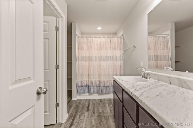 bathroom featuring hardwood / wood-style floors and vanity