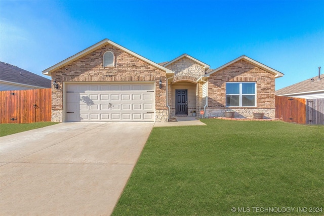 front of property featuring a front yard and a garage