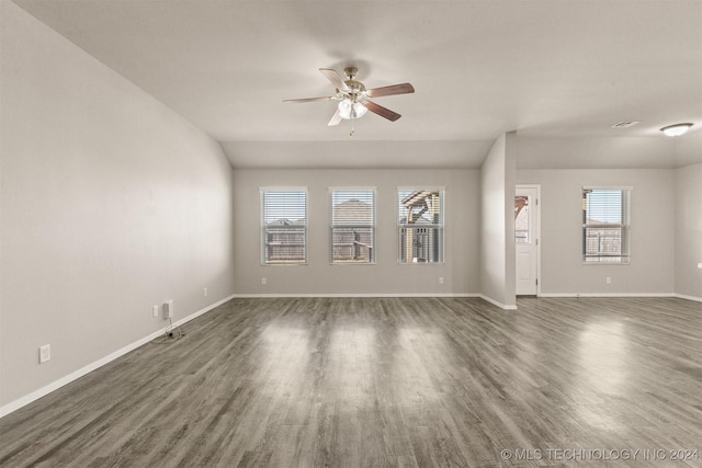 empty room featuring dark hardwood / wood-style flooring and ceiling fan