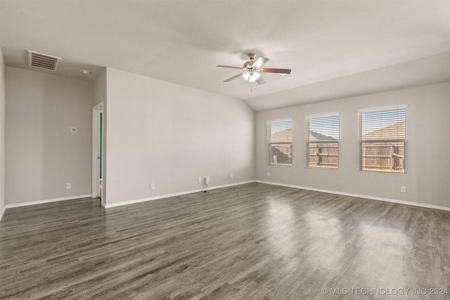 empty room featuring dark hardwood / wood-style floors, ceiling fan, and lofted ceiling