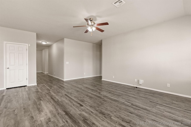 unfurnished room featuring ceiling fan and dark hardwood / wood-style flooring