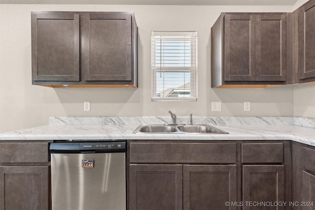 kitchen featuring stainless steel dishwasher, dark brown cabinets, and sink