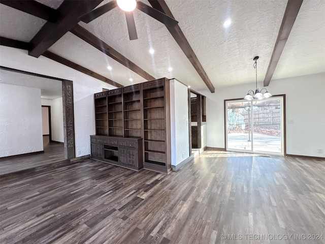 unfurnished living room with vaulted ceiling with beams, dark hardwood / wood-style flooring, a textured ceiling, and a chandelier