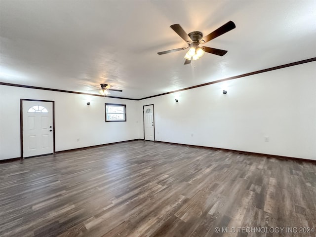 unfurnished living room featuring ceiling fan, dark hardwood / wood-style floors, and ornamental molding