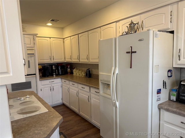 kitchen with white cabinets, dark hardwood / wood-style floors, white fridge with ice dispenser, and electric cooktop