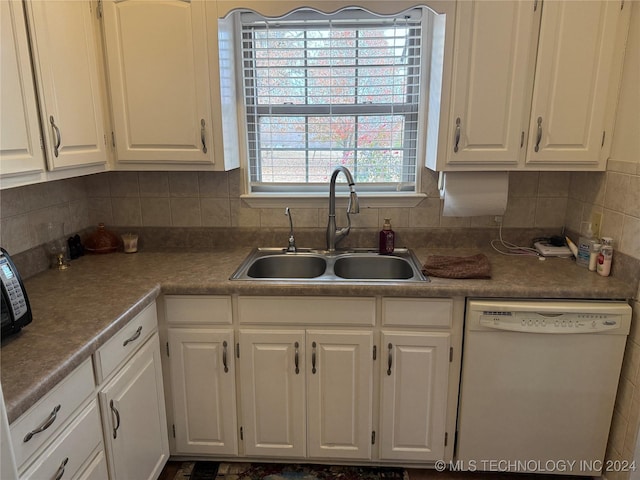 kitchen featuring dishwasher, white cabinets, a healthy amount of sunlight, and sink