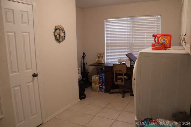 laundry area with light tile patterned flooring and washer / clothes dryer