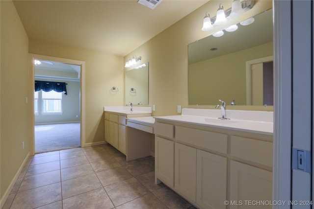 bathroom with tile patterned flooring and vanity