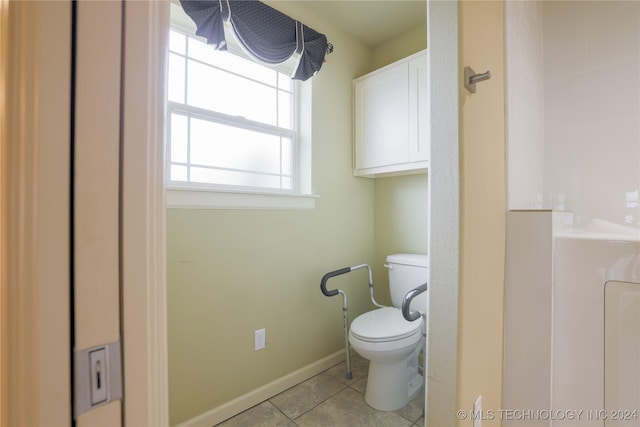 bathroom featuring tile patterned flooring and toilet