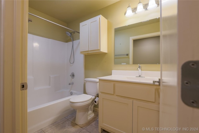 full bathroom with tile patterned floors, shower / tub combination, vanity, and toilet