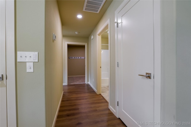 corridor featuring dark hardwood / wood-style flooring