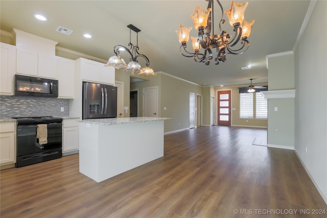 kitchen with white cabinetry, dark wood-type flooring, black appliances, ceiling fan with notable chandelier, and ornamental molding