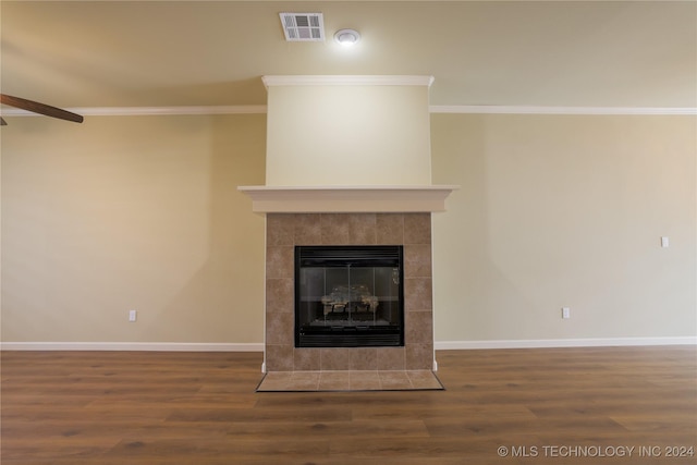 interior details featuring a fireplace, hardwood / wood-style floors, and ornamental molding