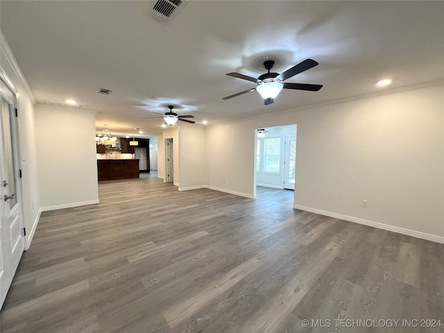 unfurnished living room with crown molding, wood-type flooring, and ceiling fan with notable chandelier