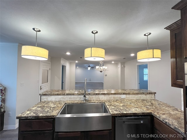 kitchen featuring dark brown cabinets, decorative light fixtures, and sink