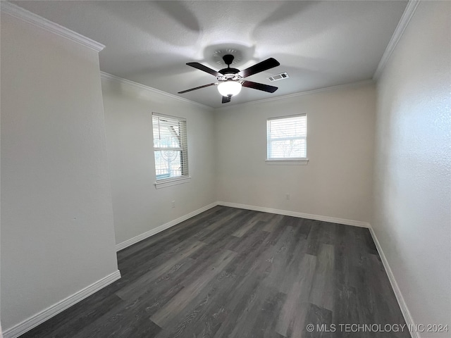 spare room featuring ceiling fan, crown molding, and dark wood-type flooring