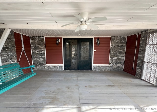 exterior space with ceiling fan